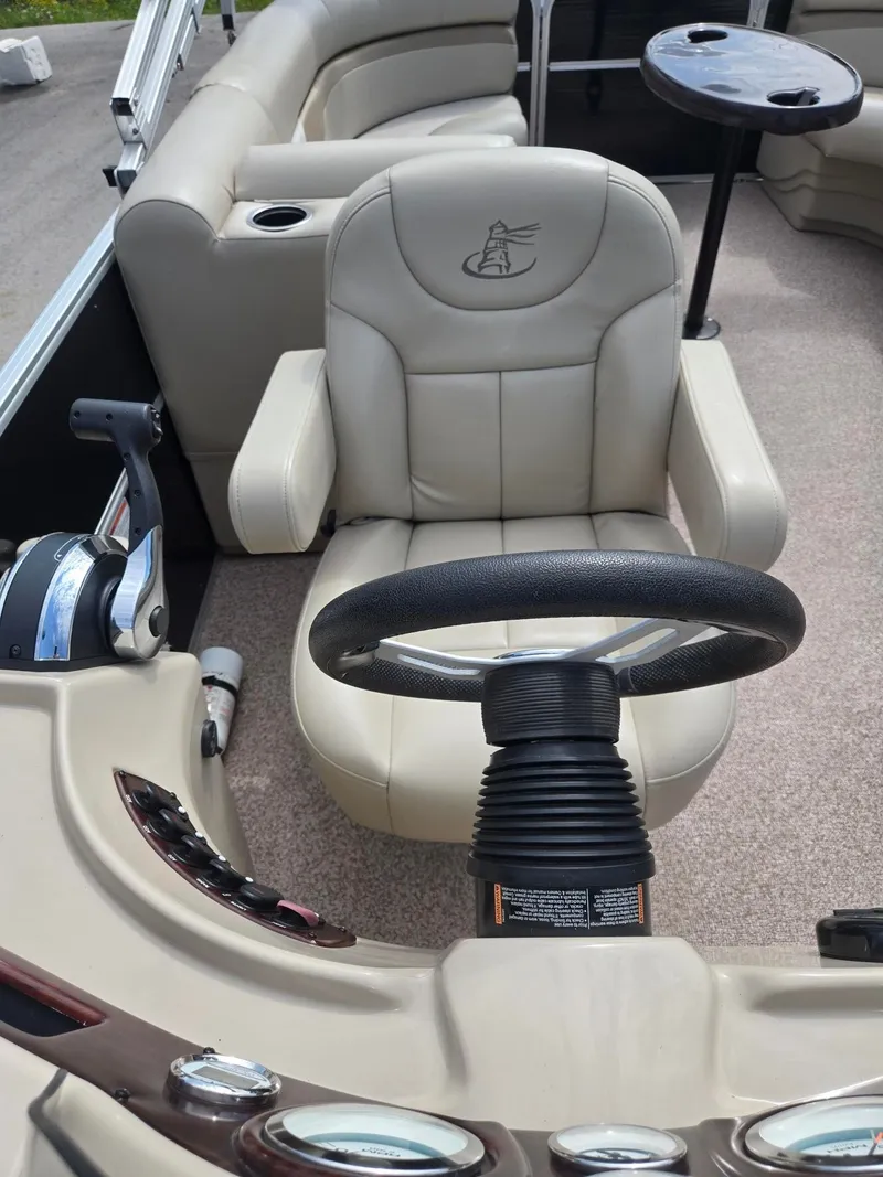 Slide: The Image of Interior of a 2017 Misty Harbor 2285 pontoon boat with steering wheel. - 10