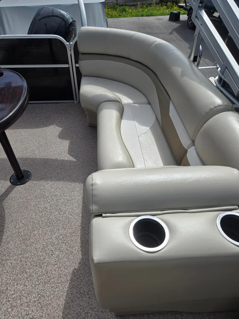 Slide: The Image of Interior of a 2017 Misty Harbor 2285 pontoon boat with beige seating. - 13