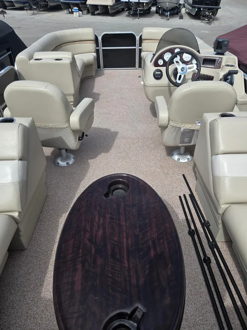 Slide: The Image of Interior of a 2017 Misty Harbor 2285 pontoon boat with beige seating. - 14