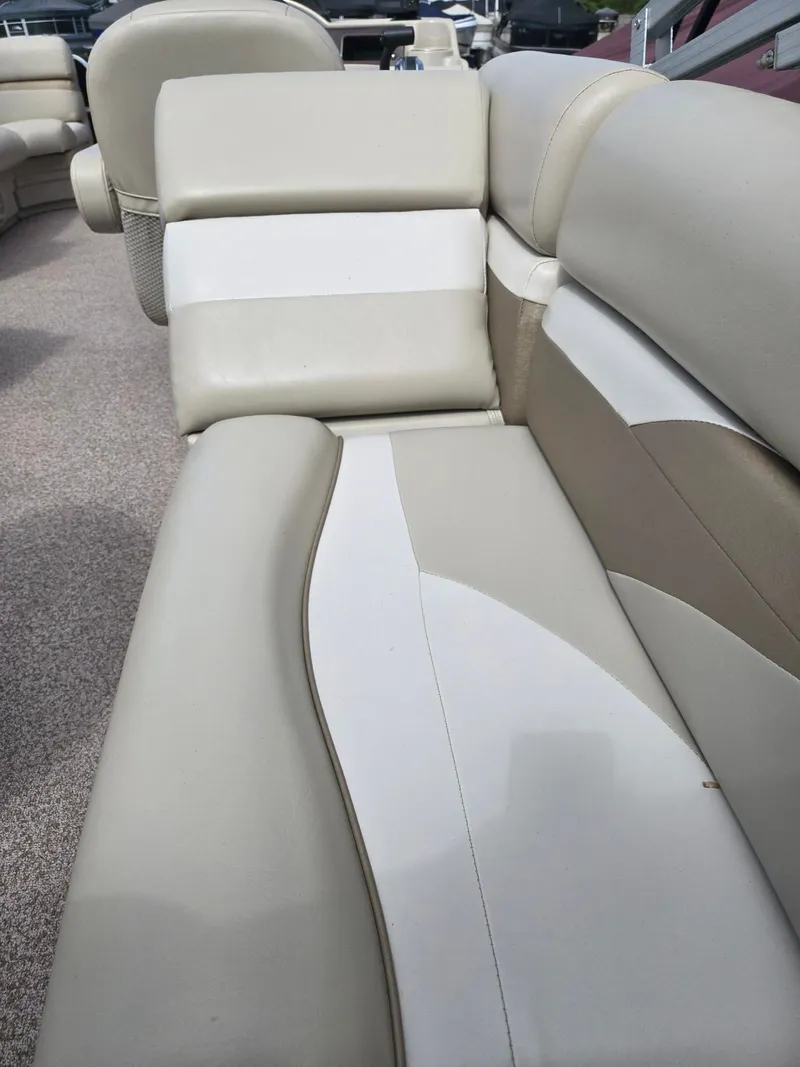 Slide: The Image of Interior of a 2017 Misty Harbor 2285 pontoon boat with beige seating. - 16