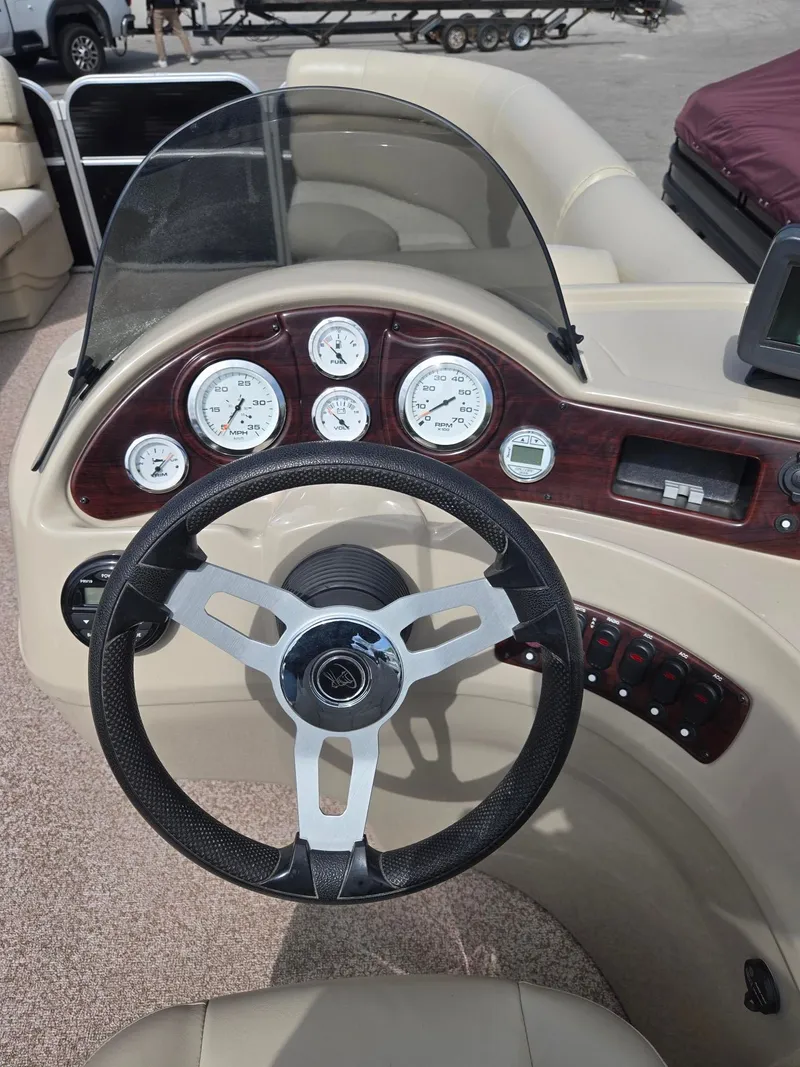 Slide: The Image of 2017 Misty Harbor 2285 boat console with steering wheel and gauges. - 19
