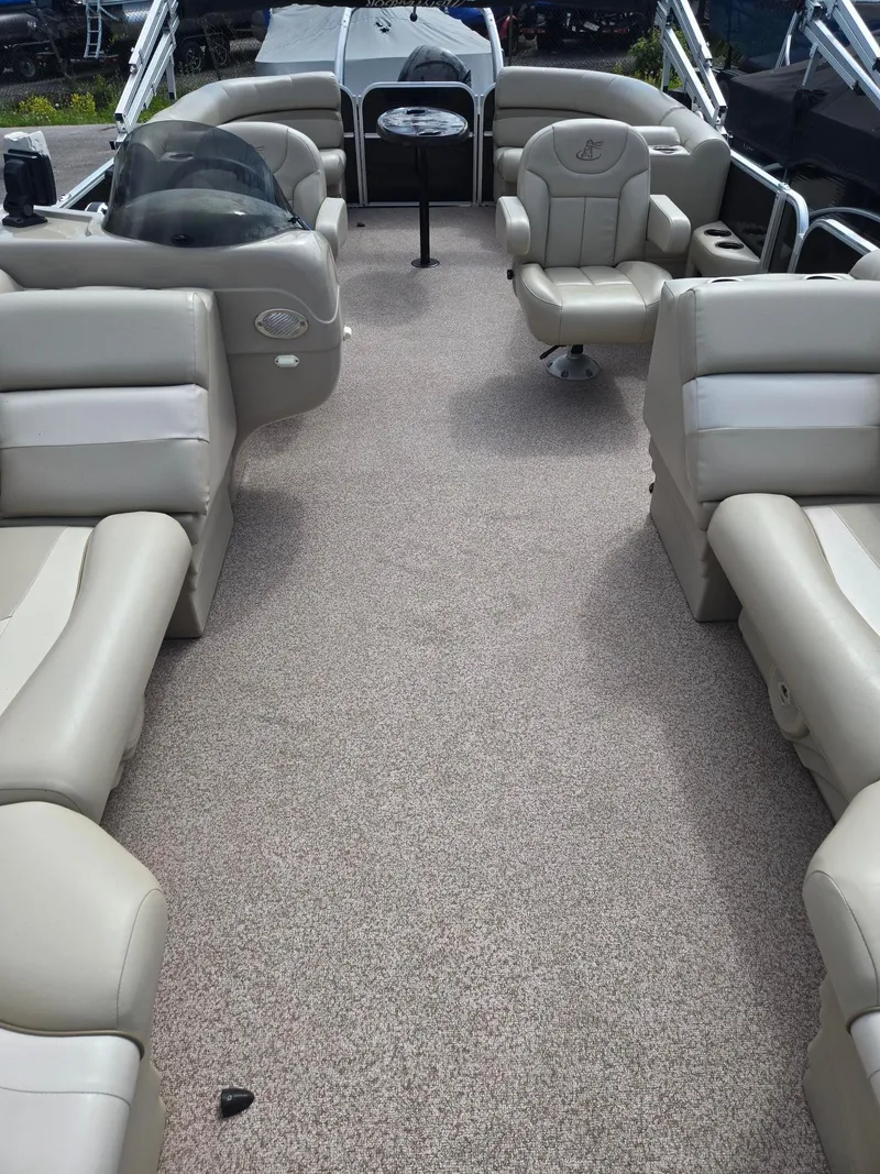 Slide: The Image of Interior of a 2017 Misty Harbor 2285 pontoon boat with beige seating. - 6