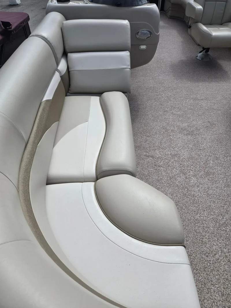 Slide: The Image of Interior of a 2017 Misty Harbor 2285 pontoon boat with beige seating. - 7