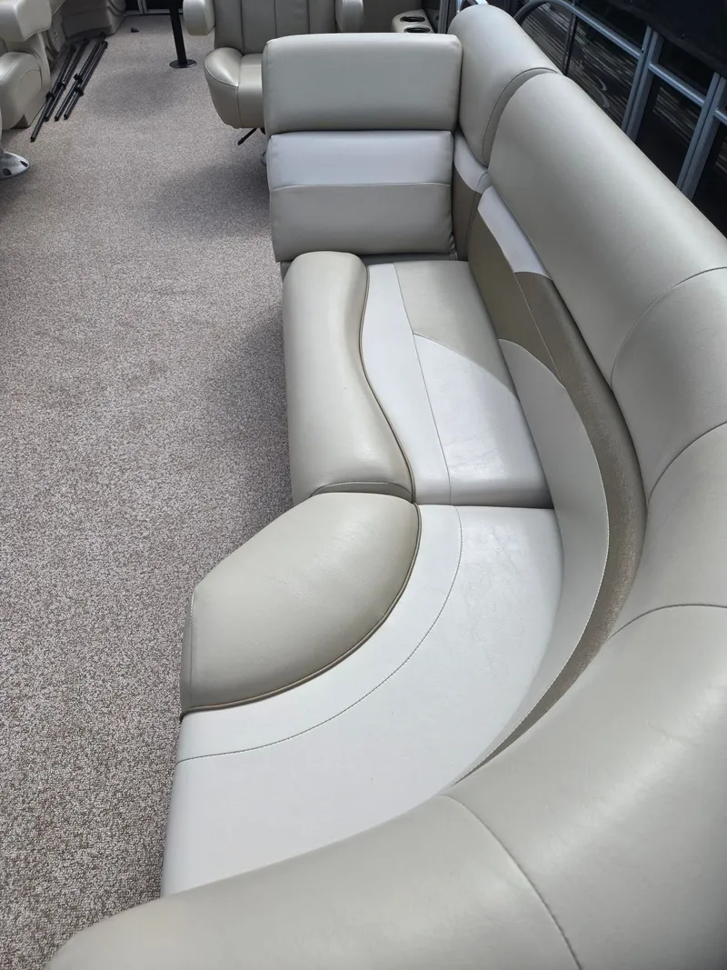 Slide: The Image of Interior of a 2017 Misty Harbor 2285 pontoon boat with beige seating. - 8