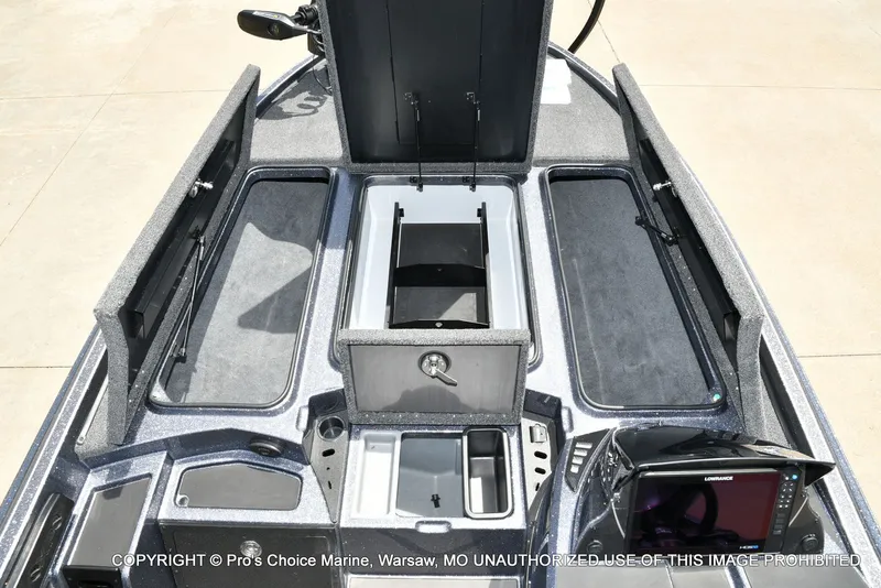 Slide: The Image of Interior view of 2024 Triton 20XP Patriot boat with storage compartments. - 10
