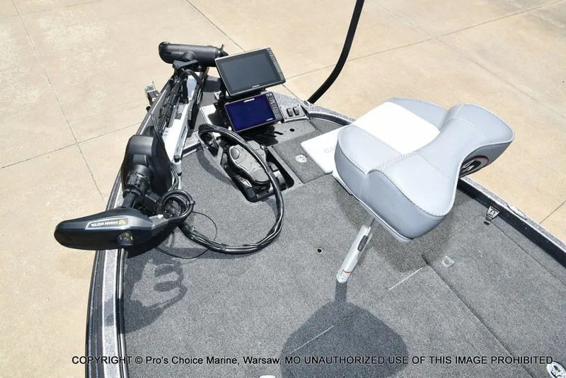 Slide: The Image of 2024 Triton 20XP Patriot boat with controls and seat. - 11