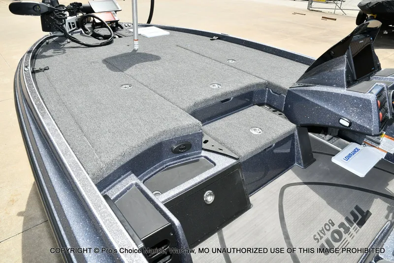 Slide: The Image of 2024 Triton 20XP Patriot boat with gray deck and control console. - 15