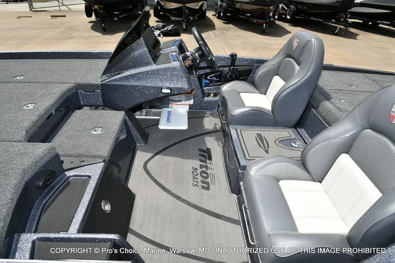 Slide: The Image of Interior of 2024 Triton 20XP Patriot with gray seats. - 16