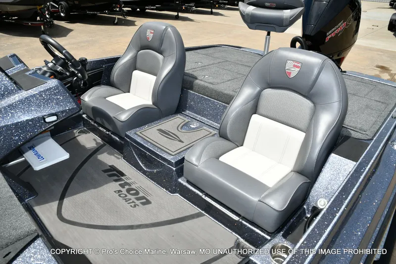 Slide: The Image of Interior of 2024 Triton 20XP Patriot with gray leather seats. - 17