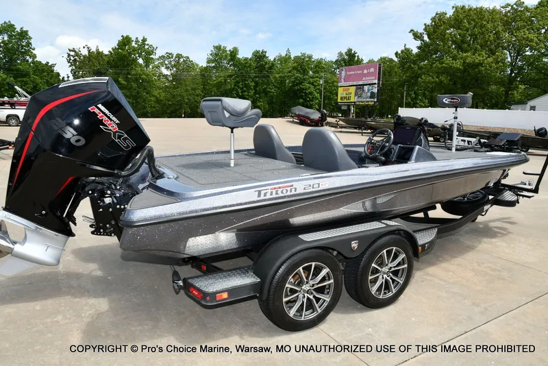 Slide: The Image of 2024 Triton 20XP Patriot boat on trailer, Mercury engine. - 20