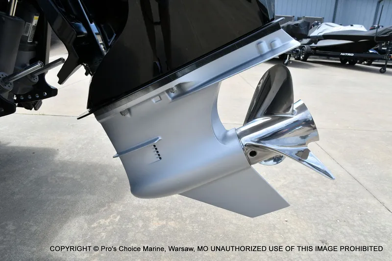 Slide: The Image of 2024 Triton 20XP Patriot boat motor with shiny propeller. - 26