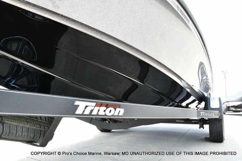 Slide: The Image of 2024 Triton 20XP Patriot boat trailer, close-up of the underside. - 37