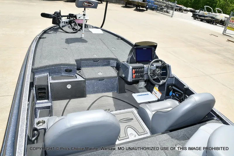 Slide: The Image of Interior of 2024 Triton 20XP Patriot boat with steering console. - 45