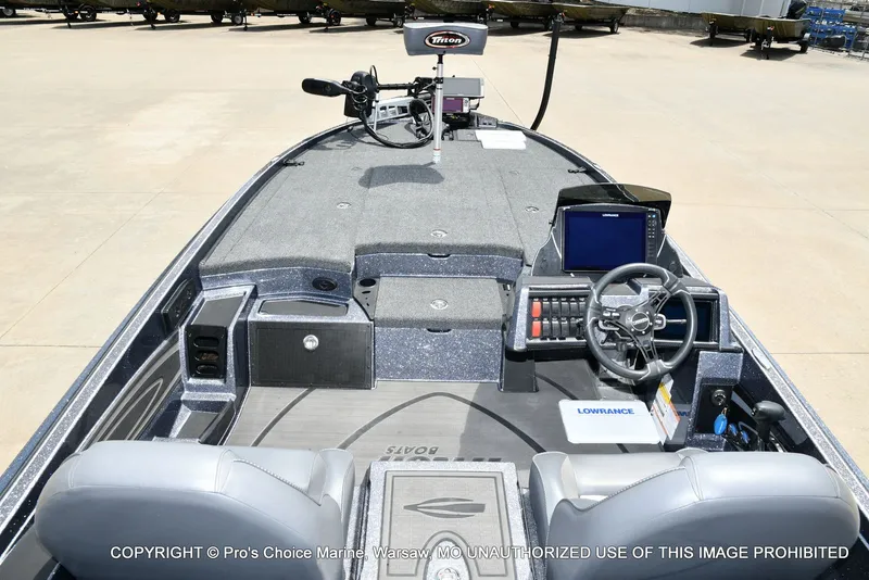 Slide: The Image of Interior view of 2024 Triton 20XP Patriot boat with control console. - 46