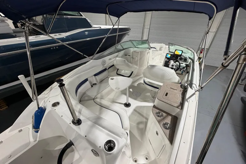 Slide: The Image of 2013 Hurricane SunDeck 2400 OB boat bathroom with toilet, sink, and window. - 15
