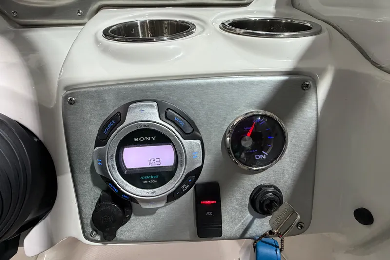 Slide: The Image of Control panel of a 2013 Hurricane SunDeck 2400 OB boat with Sony marine stereo. - 26