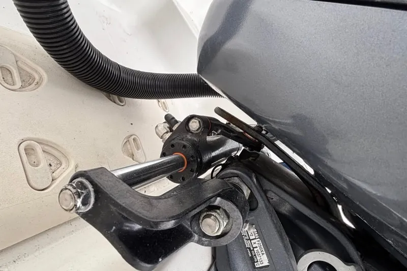 Slide: The Image of Close-up of 2013 Hurricane SunDeck 2400 OB boat engine components. - 29