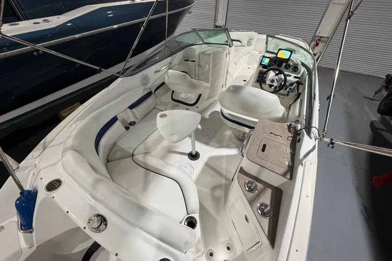 Slide: The Image of 2013 Hurricane SunDeck 2400 OB with Yamaha 250 outboard motor in a showroom. - 30