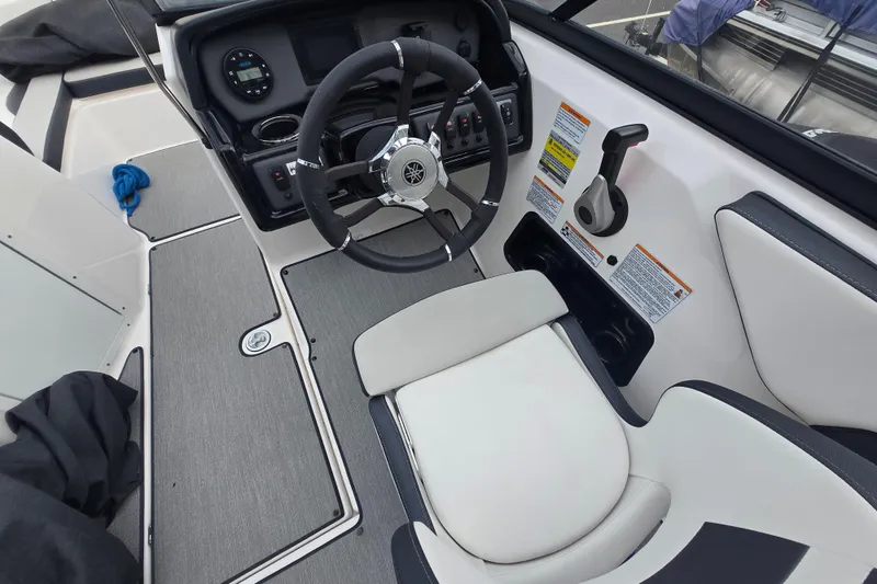 Slide: The Image of 2021 Yamaha Boats AR195 cockpit with steering wheel and control panel. - 10
