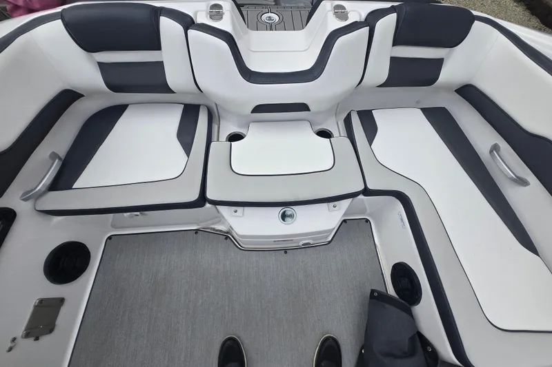 Slide: The Image of 2021 Yamaha Boats AR195 interior seating with sleek, modern design and comfortable upholstery. - 14