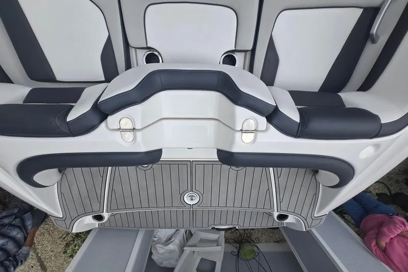 Slide: The Image of 2021 Yamaha Boats AR195 interior seating and deck, featuring sleek design and comfortable upholstery. - 16