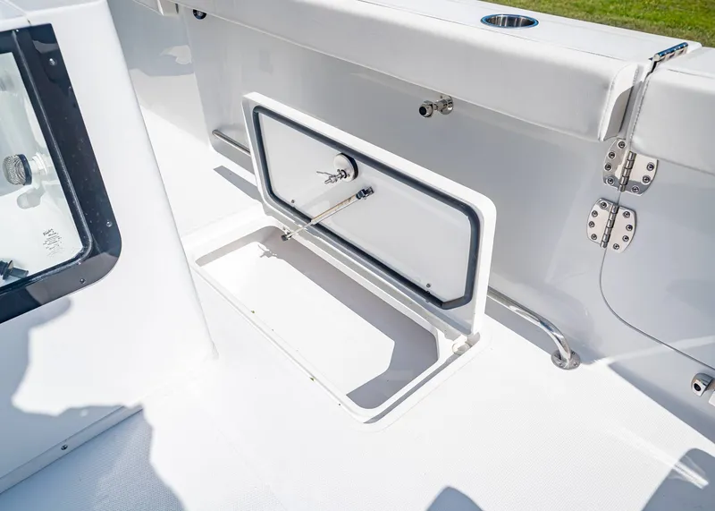 Slide: The Image of Sea Hunt Gamefish 30, 2026, open storage box on deck. - 19
