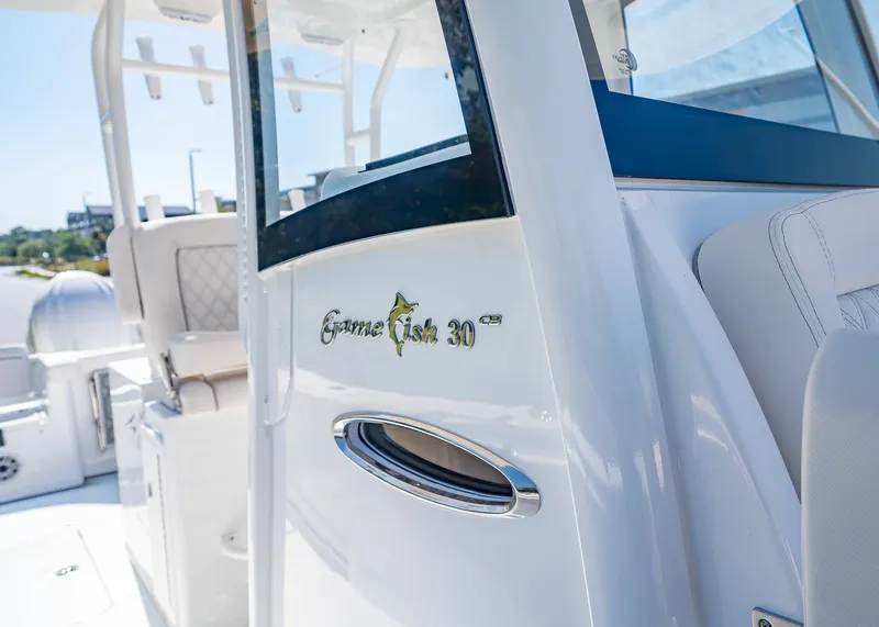 Slide: The Image of Sea Hunt Gamefish 30 boat, close-up of logo, model year 2026. - 29
