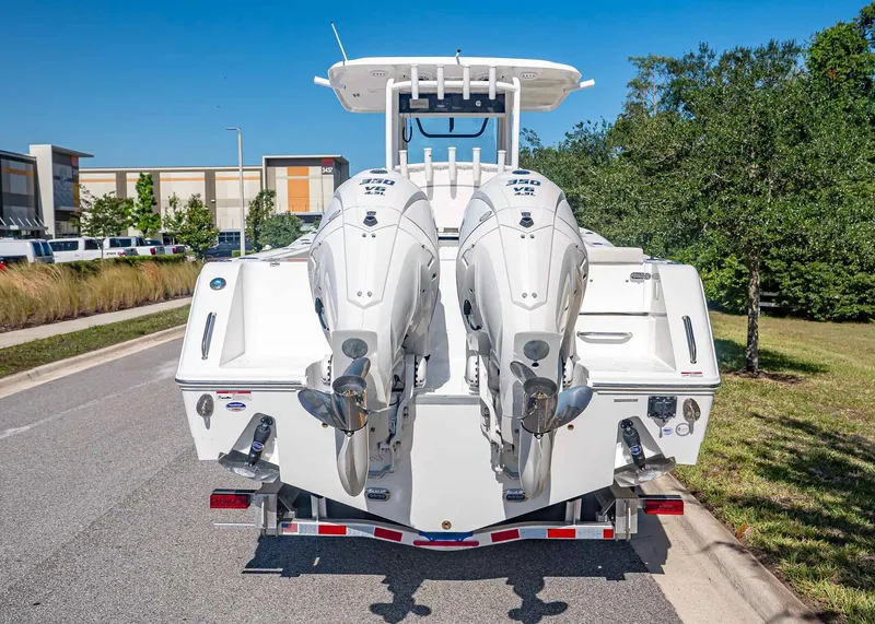 Slide: The Image of Rear view of 2026 Sea Hunt Gamefish 30 Coffin Box with twin outboard engines. - 5