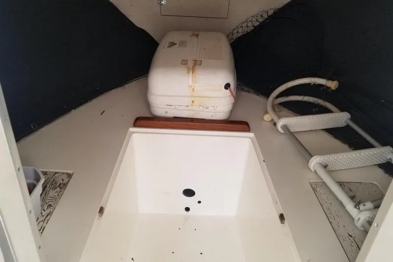 Slide: The Image of 1977 Bertram 28 Moppie cabin interior with storage and equipment. - 10