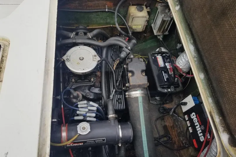 Slide: The Image of Engine compartment of a 1977 Bertram 28 Moppie boat, showing detailed components and wiring. - 6