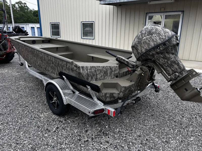 Slide: The Image of Thor Timber Hammer 60HP boat, 2026 model, parked on trailer. - 3