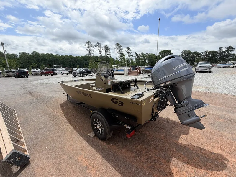 Slide: The Image of G3 GATOR TOUGH 18CC boat with Yamaha engine, 2026 model, in parking lot. - 3