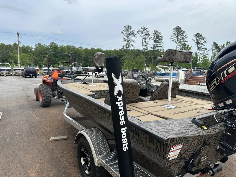 Slide: The Image of 2026 Xpress H17 boat on trailer parked outdoors. - 5