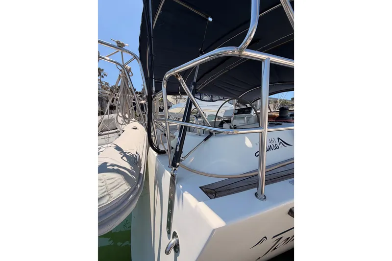 Slide: The Image of 2006 Hanse 461 sailboat with stainless steel railings and covered cockpit. - 11