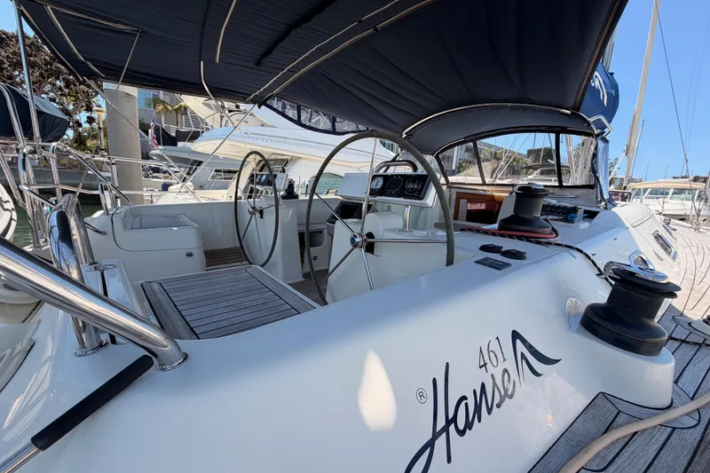 Slide: The Image of 2006 Hanse 461 yacht cockpit with dual steering wheels and sleek design. - 12