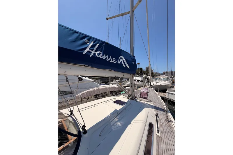 Slide: The Image of 2006 Hanse 461 sailboat docked at marina under clear blue sky. - 15