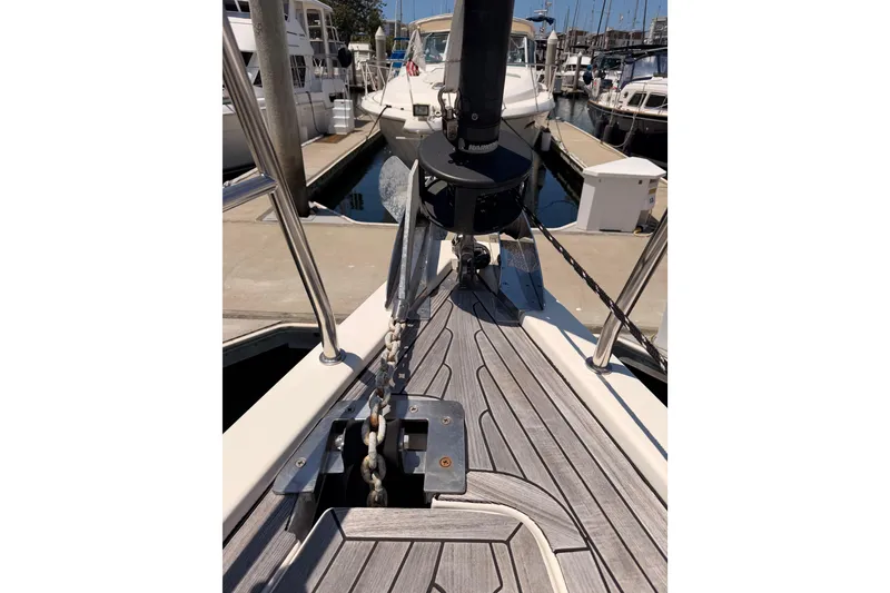 Slide: The Image of Bow of a 2006 Hanse 461 yacht with anchor chain in marina setting. - 22