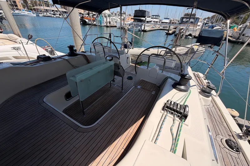 Slide: The Image of 2006 Hanse 461 yacht cockpit with wooden deck, docked in marina. - 27
