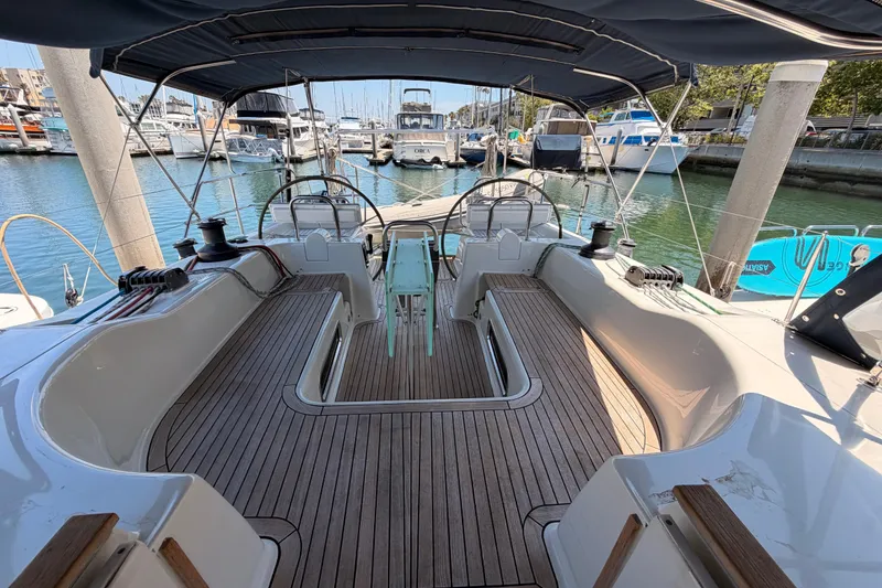 Slide: The Image of Spacious cockpit of 2006 Hanse 461 yacht docked in a marina. - 28
