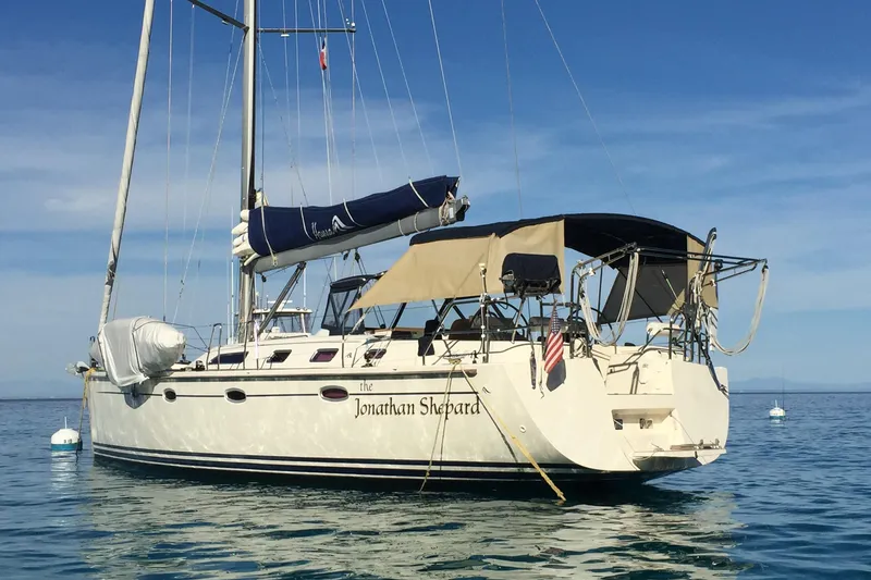 Slide: The Image of Sailing yacht Hanse 461, 2006 model, anchored on calm blue waters. - 3