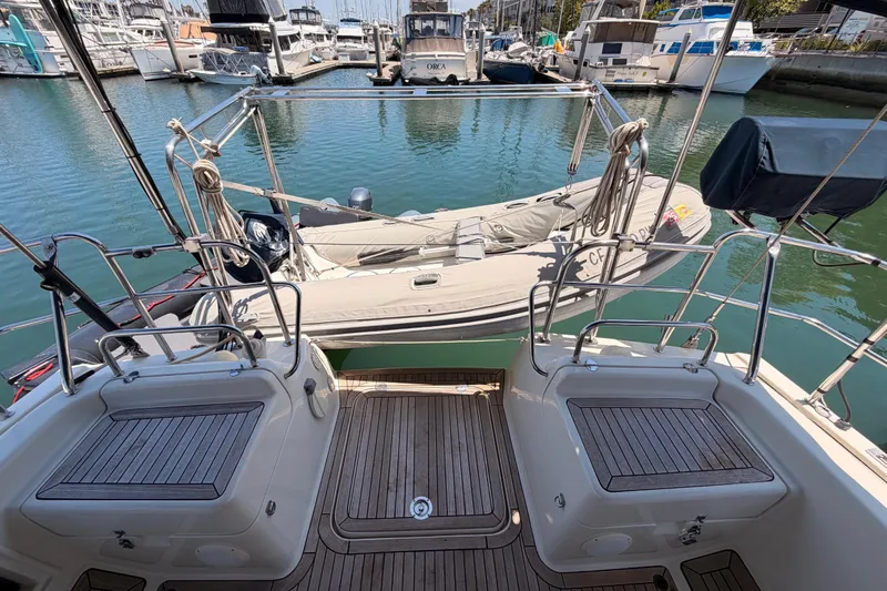 Slide: The Image of 2006 Hanse 461 yacht stern view with dinghy in marina setting. - 30