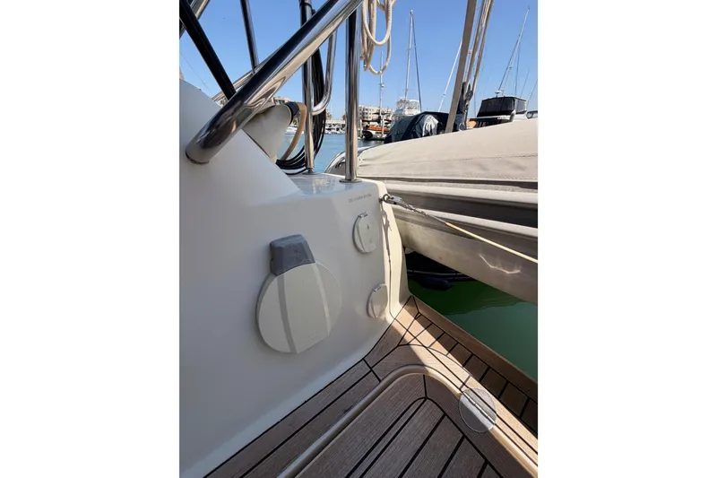 Slide: The Image of 2006 Hanse 461 yacht deck with sleek design and marina view. - 32