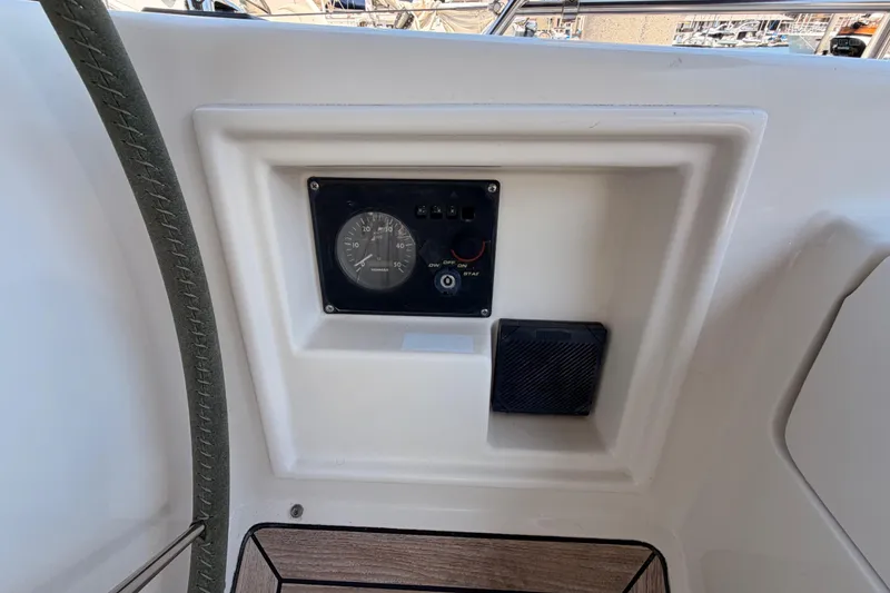 Slide: The Image of Control panel on a 2006 Hanse 461 yacht, featuring gauges and switches. - 41