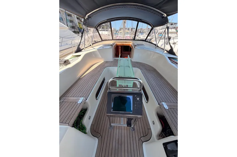 Slide: The Image of 2006 Hanse 461 yacht cockpit with wooden deck and navigation equipment. - 42