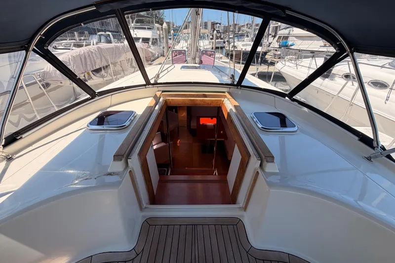 Slide: The Image of 2006 Hanse 461 yacht cockpit with open cabin entrance, docked at marina. - 43