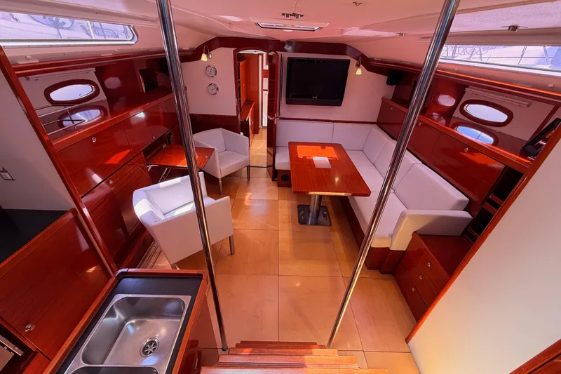 Slide: The Image of Luxurious 2006 Hanse 461 yacht interior with elegant wood finish and modern furnishings. - 44