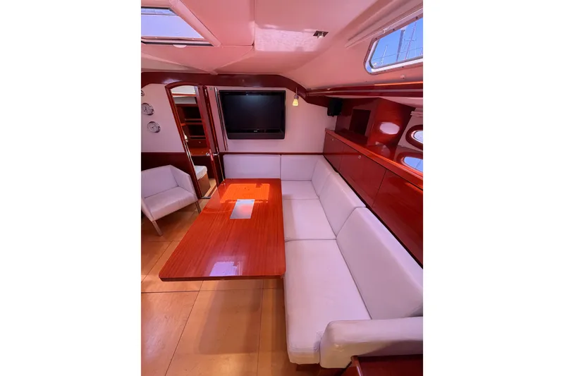 Slide: The Image of Luxurious interior of 2006 Hanse 461 yacht with elegant seating and wooden table. - 57