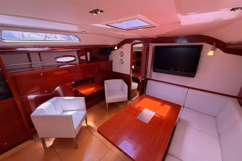Slide: The Image of Luxurious interior of 2006 Hanse 461 yacht with elegant wood finish and modern seating. - 58