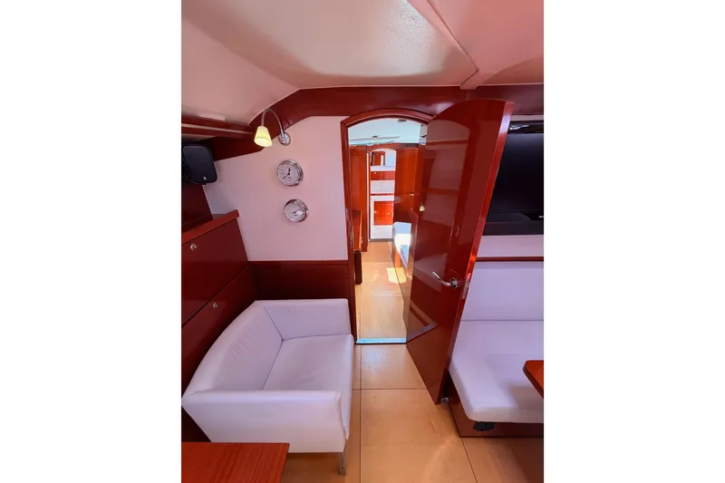 Slide: The Image of Interior of 2006 Hanse 461 yacht with modern furnishings and wooden accents. - 63