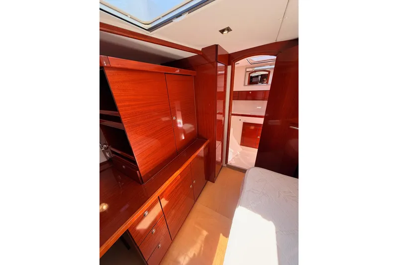 Slide: The Image of Luxurious wooden interior of 2006 Hanse 461 yacht cabin with ample storage. - 66